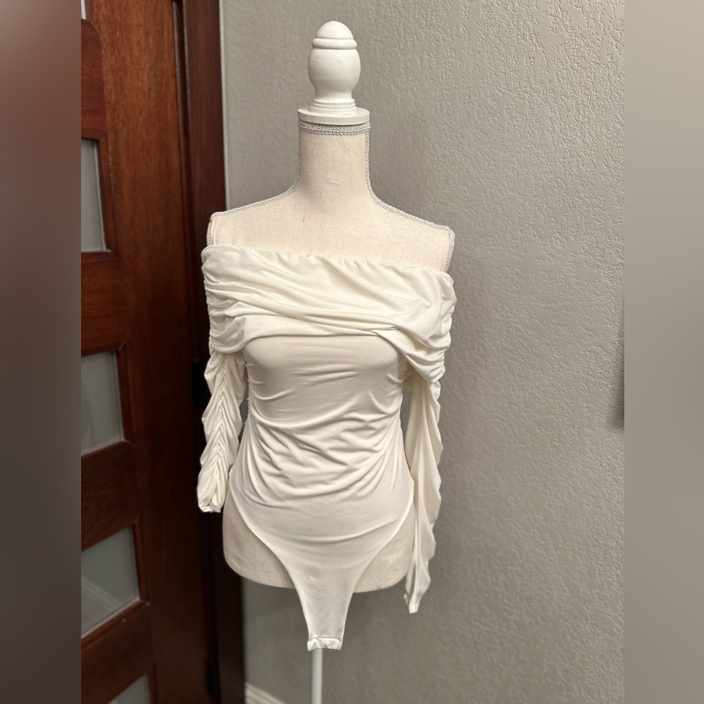 White Karen Millen bodysuit.